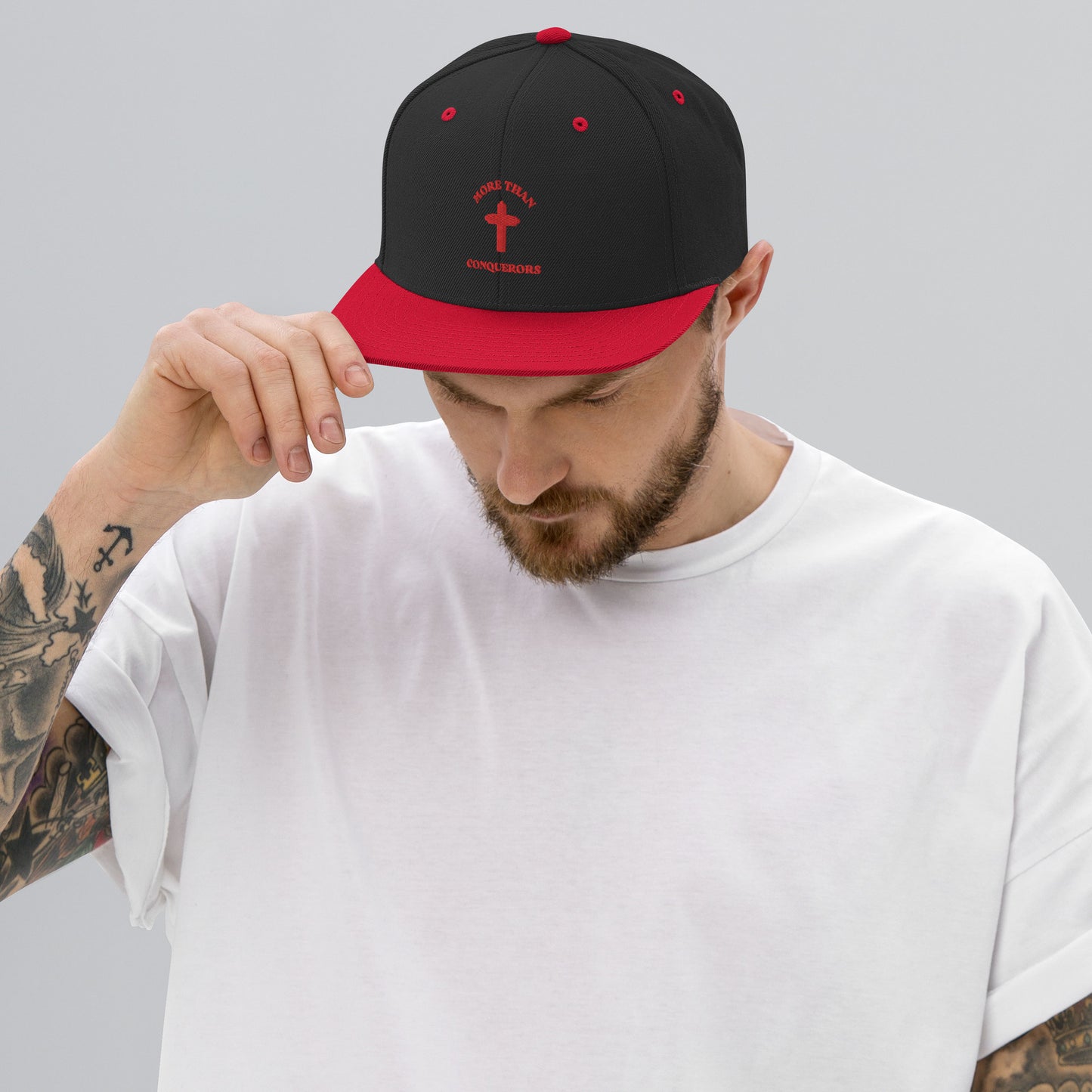 MORE THAN CONQUERORS Black & Red Snapback Cap